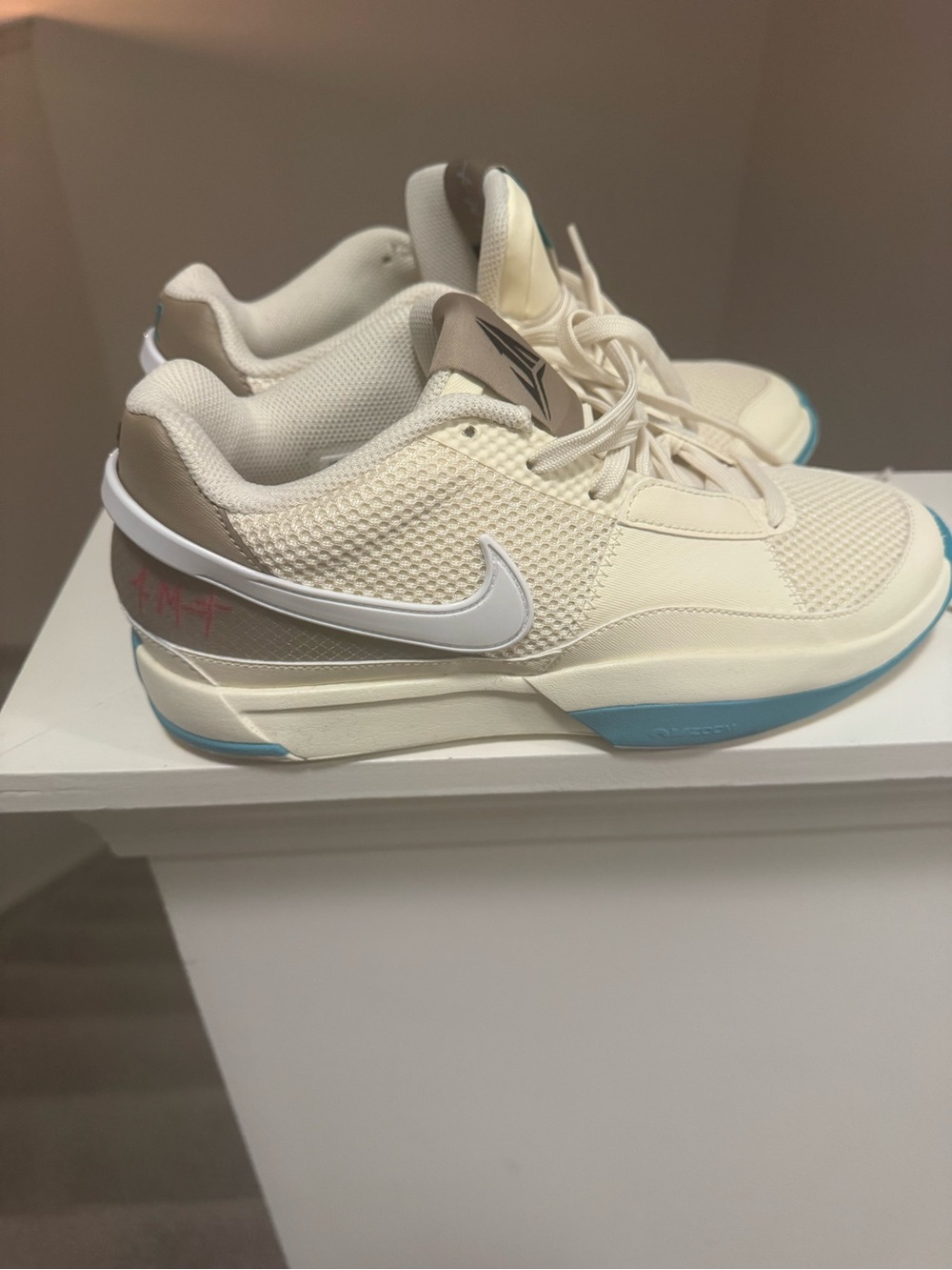 Nike Women's Cream Sneakers with Blue Accents